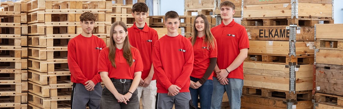 A group picture of all the TGW Logistics group apprentices with red t-shirts